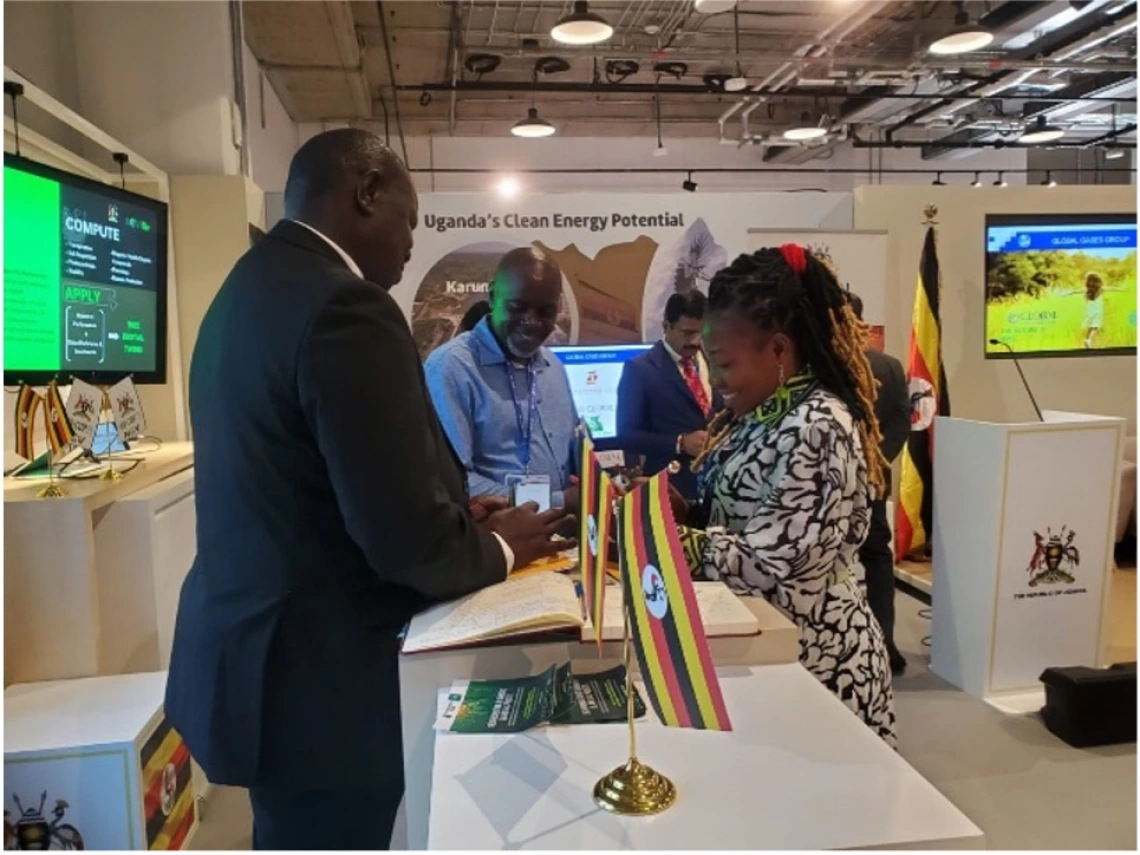 Talking to Hons. Esenu and Abaed Bwanika from the Parliamentary Committee on Agriculture at the Uganda Pavilion 